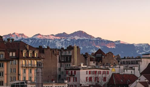Aerial view of the City of Lausanne with buildings and mountains